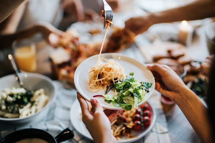 Plates of pasta and salad