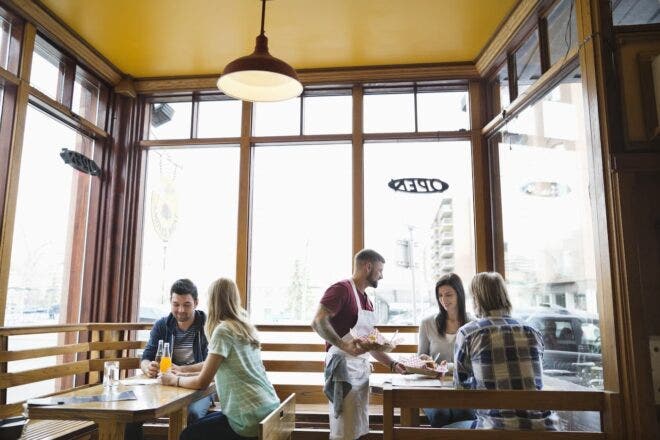 Restaurant server handling multiple tables
