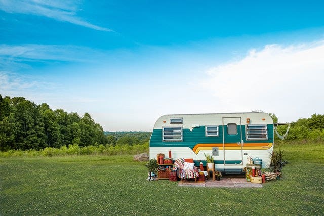 Retro vintage camper in a field.