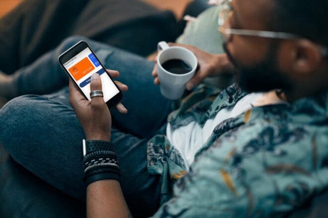 Man making purchase on mobile with digital gift card