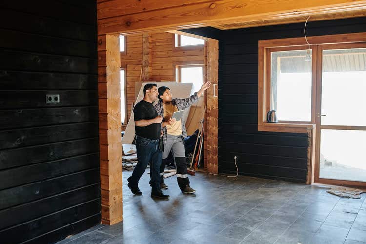 Two people discussing restaurant renovation